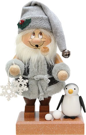 Ein Wichtel von Ulbricht mit Schneeflocken und einem kleinen Pinguin